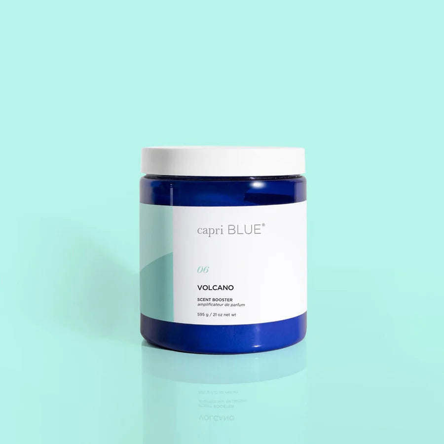 A blue jar labeled 'CB Voleano' scent booster from Capri Blue, against a light blue background.