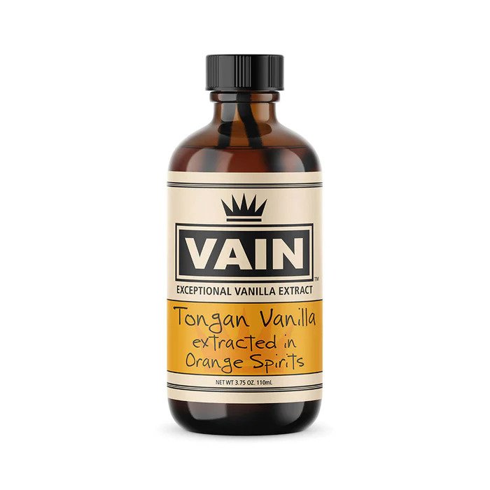 A bottle of VAIN Tonga Vanilla Extract in Orange Spirits, with a label that has the brand name, product name, and volume information.
