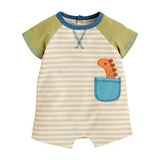 A shortall for babies with striped pattern, green sleeves, and a dinosaur design on the pocket.