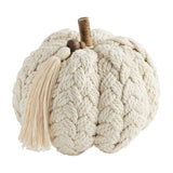 A plush, cream-colored braided pumpkin with a tassel and a wooden stem.