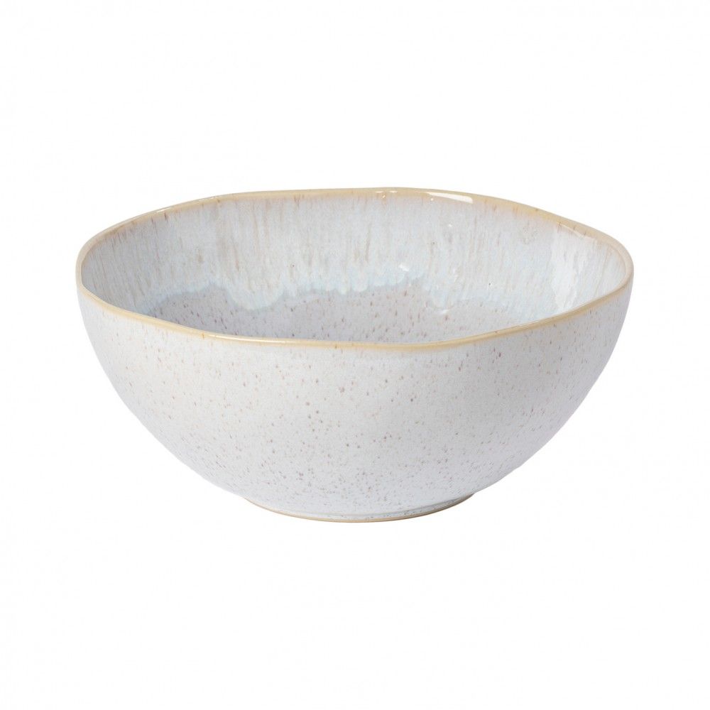 A ceramic serving bowl with a pale blue interior and a speckled pattern with a golden rim on the exterior.