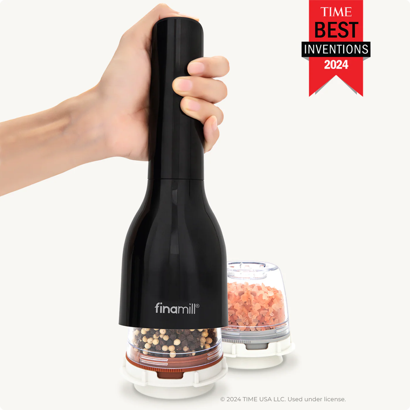 Black manual pepper grinder held by a hand with 'Time Best Inventions 2024' badge.