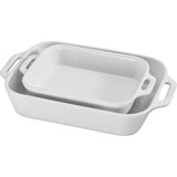 Two white rectangular baking dishes with handles.