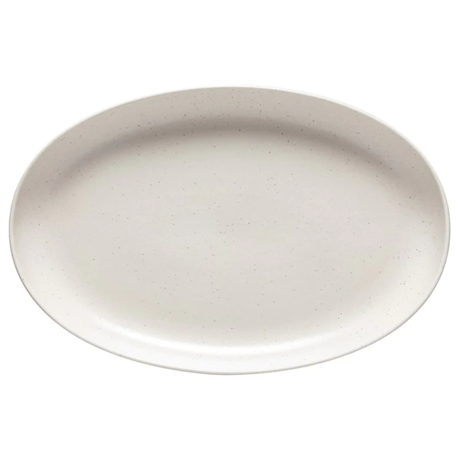 An oval-shaped vanilla pacific platter with a mottled edge design.