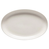 An oval-shaped vanilla pacific platter with a mottled edge design.