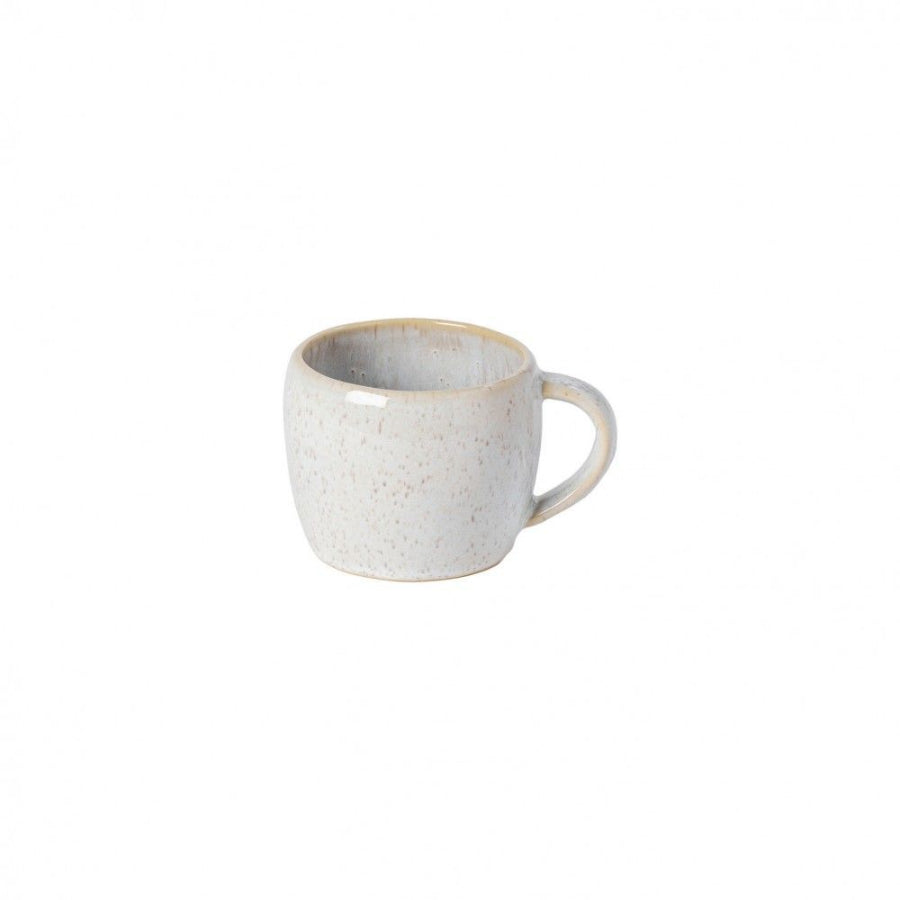 white mug w brown speckles with white backdrop