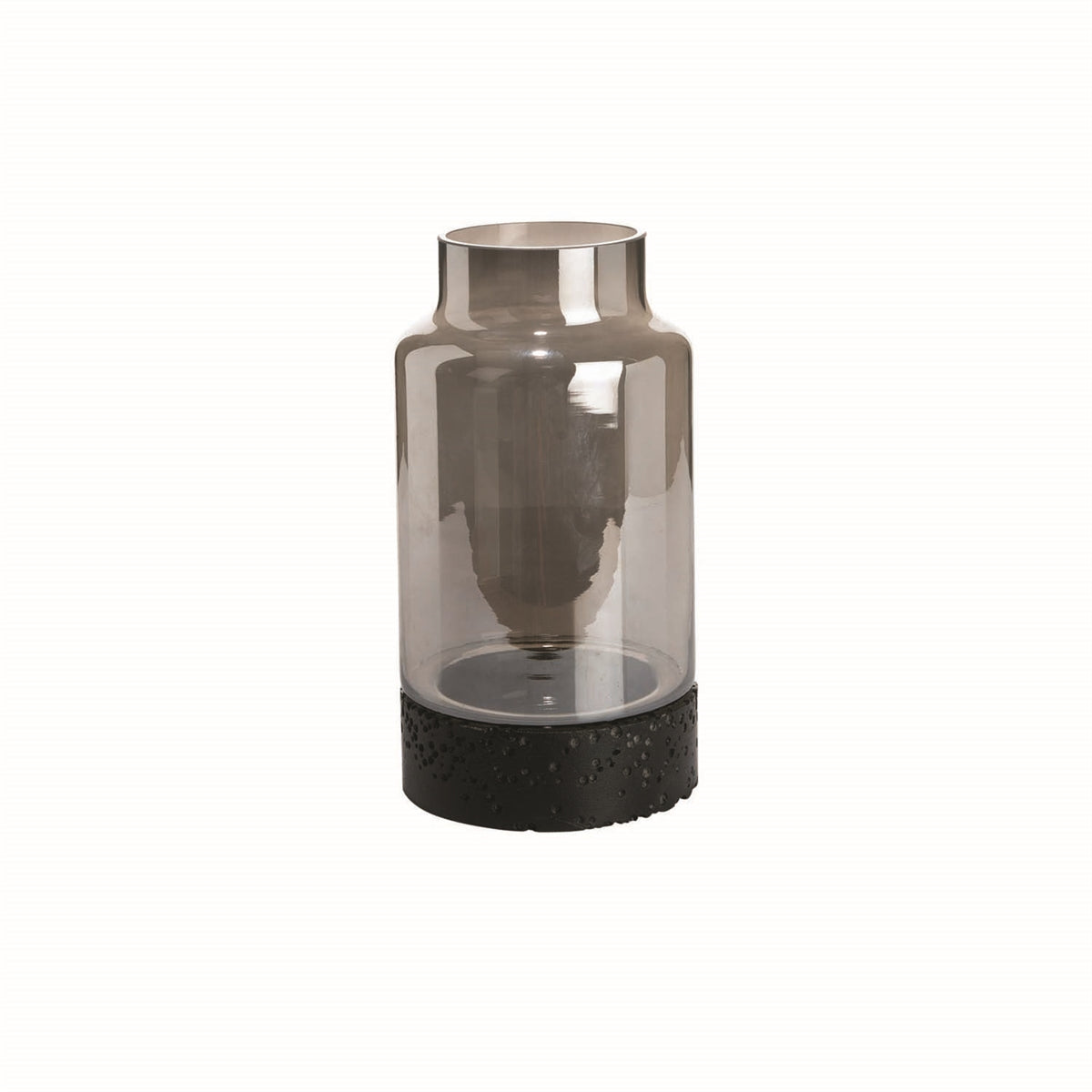 A cylindrical glass vase with a metallic top and a black clay base.