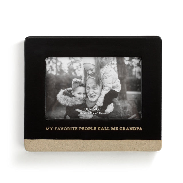 A ceramic picture frame with a black border and a photo of a grandfather with his grandchildren inside. The text on the frame reads 'MY FAVORITE PEOPLE CALL ME GRANDPA'.