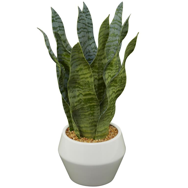 An artificial snake plant (Sansevieria) in a white ceramic pot.