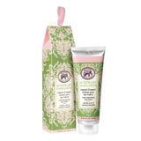 A tube of Rosemary Margarita hand cream next to its packaging box, both with floral designs and pink accents.