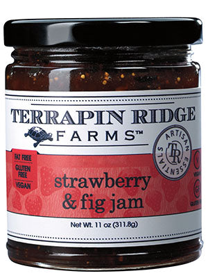 A jar of Terrapin Ridge Farms Strawberry & Fig Jam with the label facing forward. The label indicates that the jam is gluten-free, oil-free, vegan, and dairy-free.