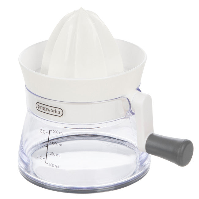 A white and clear crank-it citrus juicer with a manual handle and a measuring scale on the container.