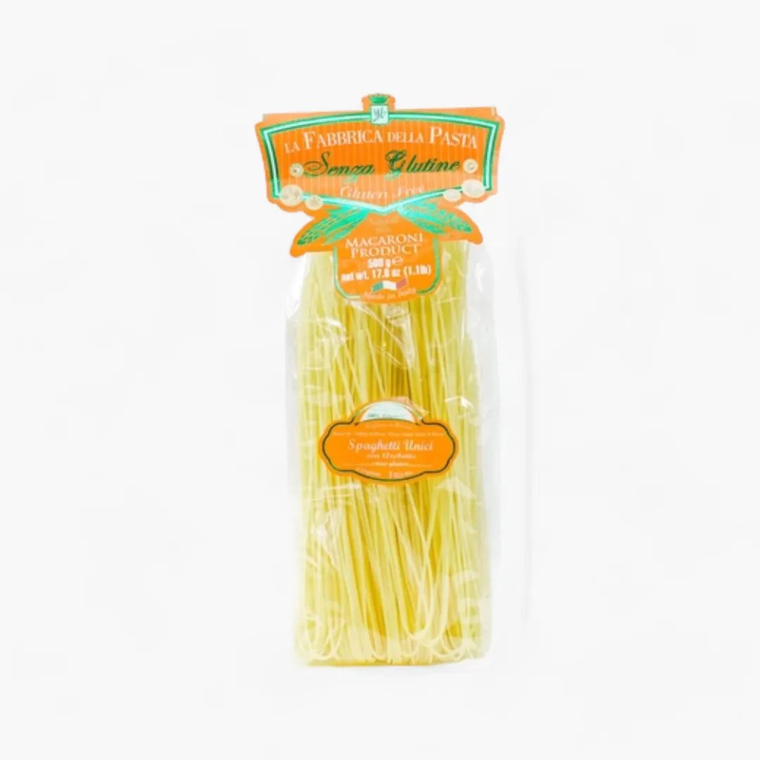 Package of La Fabbrica della Pasta gluten-free penne pasta on a white background
