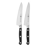 A set of two Zwilling Pro stainless steel prep knives with black handles and serrated edges.