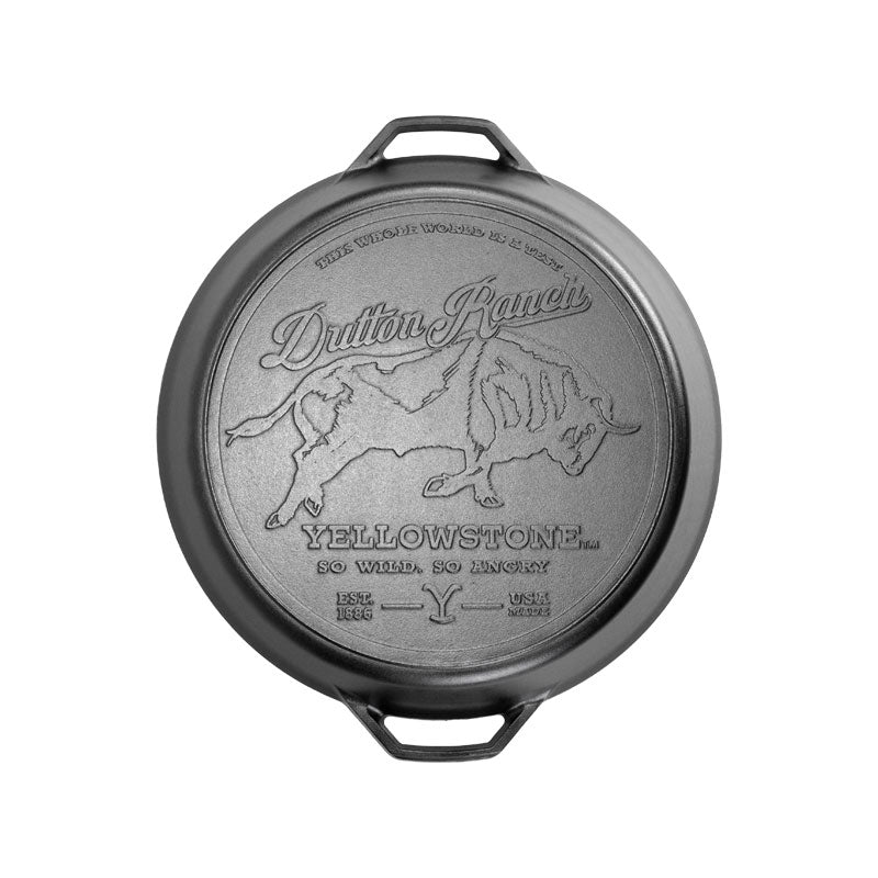 A cast iron skillet with a lid featuring a bull design and the text 'Durant Manufacturing Co., Yellowstone, Montana.'